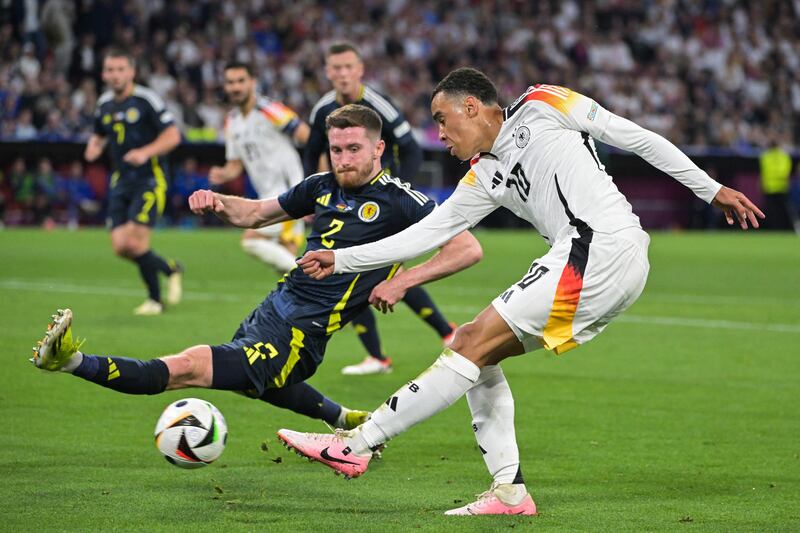 Germany's midfielder Jamal Musiala shoots but fails to score past Scotland's defender Anthony Ralston during the Euro 2024 curtainraiser. Photograph: Damien Meyer/Getty Images