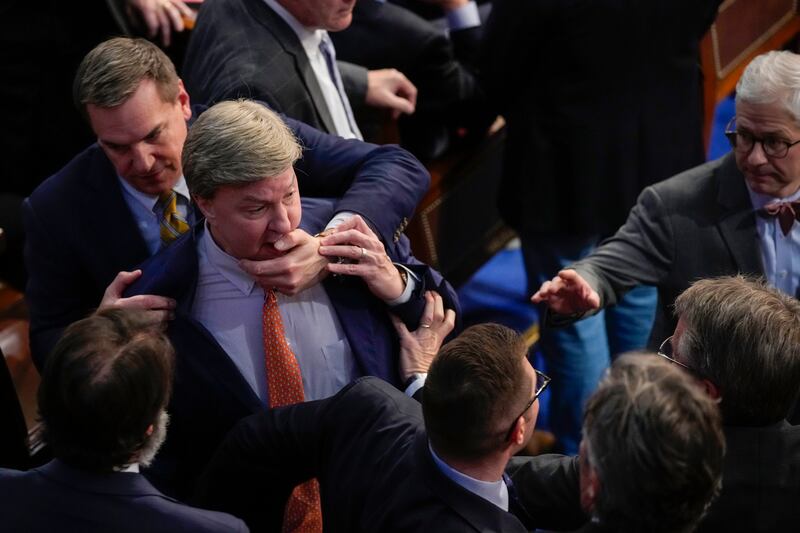 US Congress: Richard Hudson restrains Mike Rogers as they talk to Matt Gaetz. Photograph: Andrew Harnik/AP
