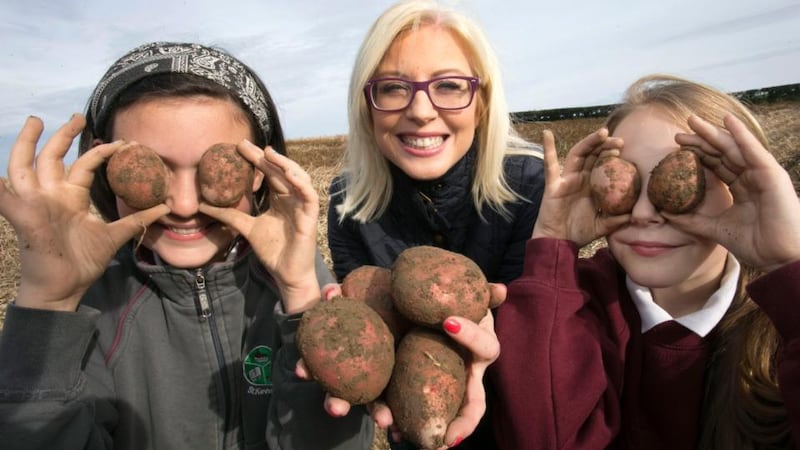 National Potato Day: Sarah Guinan and Áine Kelledy from St Kevin’s National School in Philipstown, Co Louth, at John Carroll’s potato farm, in Paughanstown, with the dietician Aoife Hearne. Photograph: Colm Mahady/Fennell