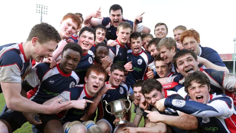 The Sligo Grammar team celebrate winning the Connacht Schools Senior Cup title after beating Garbally College in the final replay at the Showground, Galway, yesterday. Photograph: Mike Shaughnessy/Inpho.
