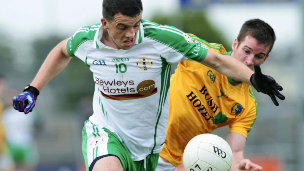London’s Greg Crowley tries to break past Leitrim’s Barry Prior at Dr Hyde Park on Sunday. Photograph: Mike Shaughnessy/Inpho