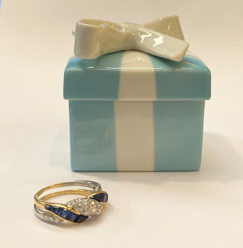 Two- stone sapphire and diamond ring in a Tiffany & Co porcelain box