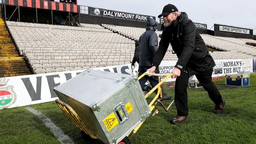 TV crew at Dalymount Park pack up their gear after the live broadcast of the game between Bohemians and Shamrock Rovers was cancelled due to health and safety concerns. Photograph: Ryan Byrne/Inpho