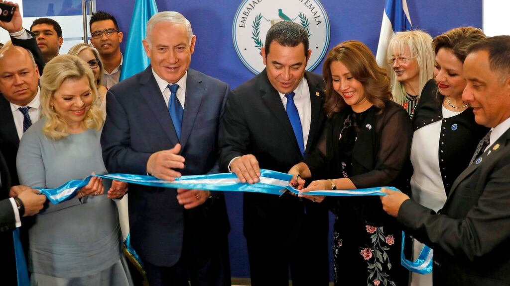 Sara Netanyahu and her husband, Israeli prime minister Binyamin Netanyahu, applaud as Guatemalan president Jimmy Morales and his wife Hilda Patricia Marroquin cut the ribbon during the inauguration ceremony of the Guatemalan embassy in Jerusalem on Wednesday. Photograph: Ronen Zvulun/AFP/Getty Images