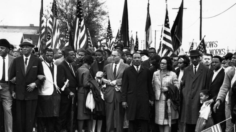 Civil rights campaigner Dr Martin Luther King Jr with his wife Coretta Scott King, at a black voting rights march from Selma, Alabama, to the state capital in Montgomery in March, 1965. Photograph: William Lovelace/Express/Getty Images