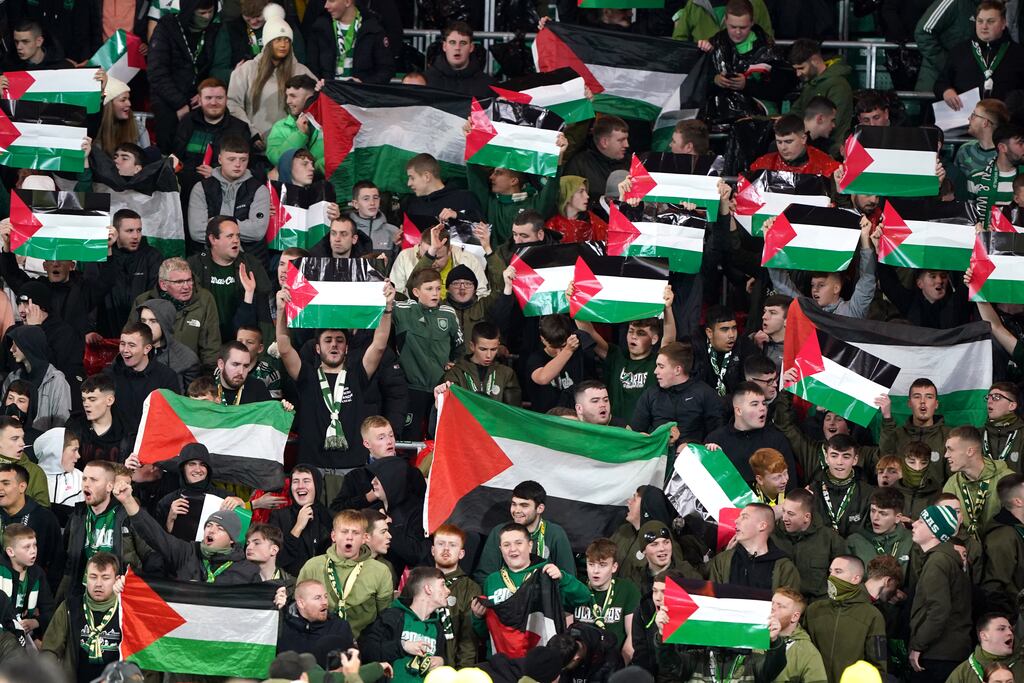 Celtic fans in the stands hold up flags of Palestine ahead of the Champions League match at Celtic Park. Photograph: Andrew Milligan/PA Wire