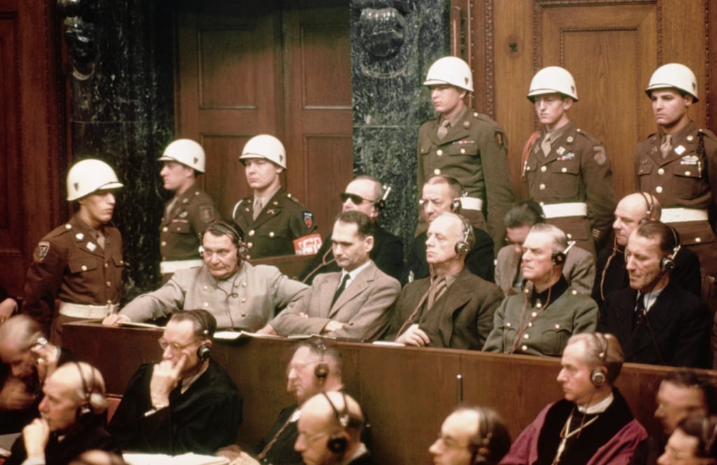 The defendants at the Nuremberg Nazi trials. Front row: Hermann Göring, Rudolf Hess, Joachim Von Ribbentrop, Wilhelm Keitel and Ernst Kaltenbrunner. Back row: Karl Dönitz, Erich Raeder, Baldur von Schirach and Fritz Sauckel. Photograph: Bettmann archive