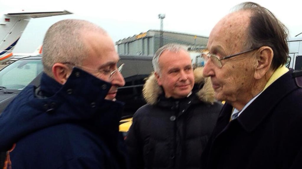 Mikhail Khodorkovsky (left) is greeted at Schönefeld airport in Berlin by former German foreign minister Hans-Dietrich Gensche. Photograph: Khodorkovsky website handout/Reuters