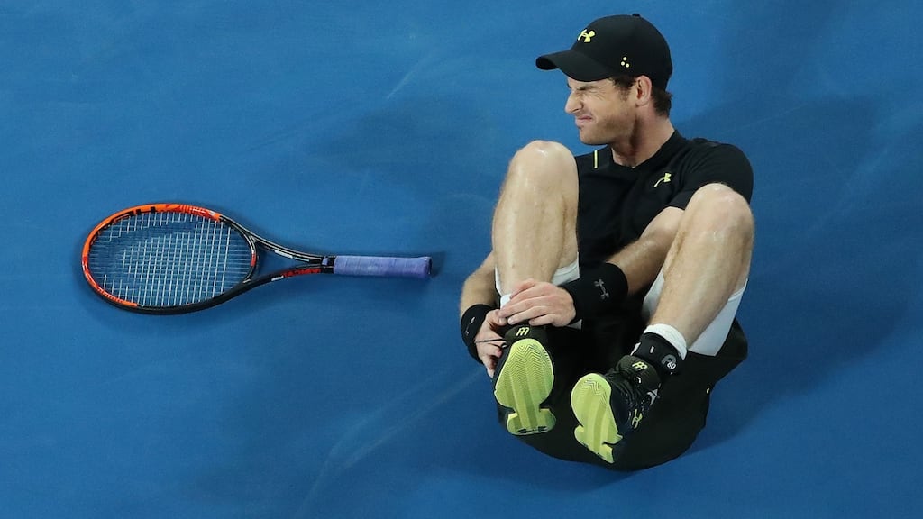 Andy Murray holds his ankle after he fell over in his second round match against Andrey Rublev of Russia on day three of the 2017 Australian Open. Photo: Scott Barbour/Getty Images