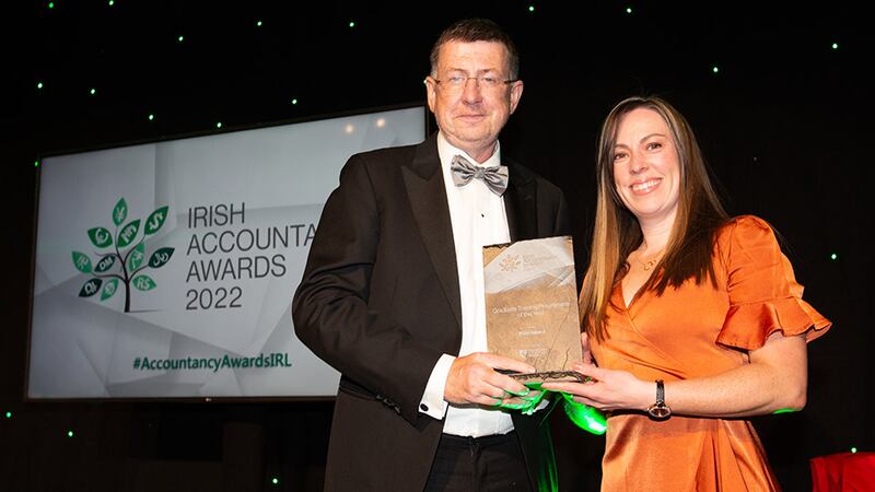 Pat O’Neill, president, Chartered Accountants Ireland (partner EY), presents the Graduate Training Programme of the Year award to Kate Connellan, RSM Ireland.