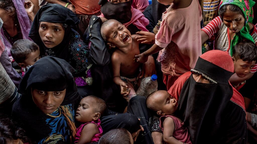 Rohingya refugees wait to be registered in Teknaf in late in  2017. The blurring of fact and fiction may undermine their case. Photograph: Tomas Munita/New York Times