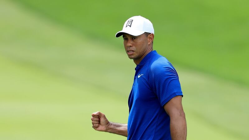 Tiger Woods reacts after making a huge birdie on the 18th green. Photo: Sam Greenwood/Getty Images