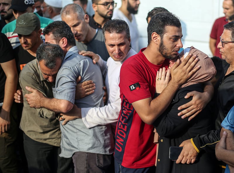 People grieve for loved ones who were killed in an Israeli air strike during a funeral in Khan Younis on Tuesday. Photograph: Yousef Masoud/New York Times