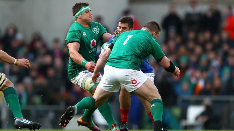 France’s Thomas Ramos is taken down by Ireland’s CJ Stander and Cian Healy. Photograph: James Crombie/Inpho