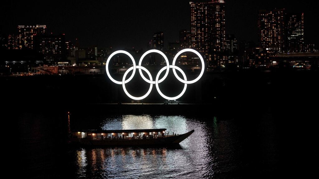 The Olympic rings a at Tokyo’s Odaiba district on Monday. Japan’s prime minister admitted a delay could be “inevitable”. Photograph: Behrouz Mehri /AFP