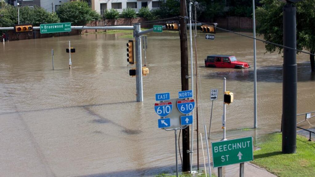 Floodwaters cover an intersection in Houston, Texas, today. Photograph: Daniel Kramer/Reuters