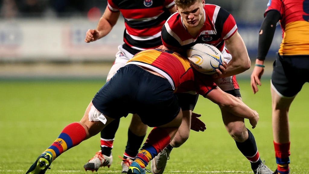 Wesley College’s Daniel Gilmer is tackled by St Fintan’s Jack Aungier during the Vinny Murray Cup clash at Donnybrook. Photograph: Ryan Byrne/Inpho