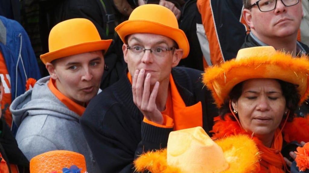People attend the celebrations for the new King Willem-Alexander who succeeds his mother Queen Beatrix, in Amsterdam’s Dam Square today. Photograph: Kevin Coombs/Reuters