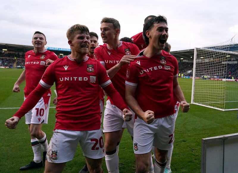 Wrexham's Tom O'Connor (right) celebrates scoring his side's winning goal in the FA Cup third-round tie against Shrewsbury Town. Photograph: Nick Potts/PA Wire
