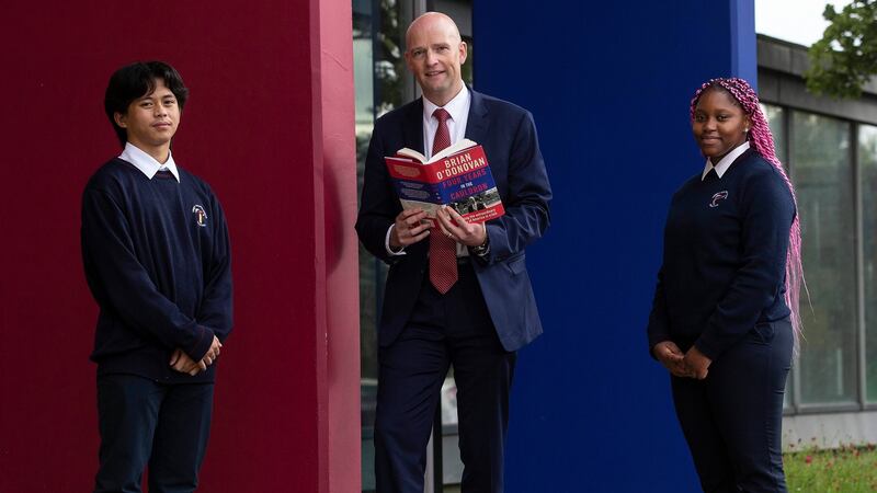Brian O’Donovan, RTÉ Washington correspondent, launching his book, Four Years in the Cauldron, with Frank Christian Ajoc and Thembi Nkosi at Trinity Comprehensive School in Ballymun. Photograph: Damien Eagers