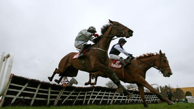 Morning Assembly under jockey Davy Condon (left) jumps the last to win ahead of Inish Island under jockey Paul Townend during the Irish Daily Mirror Novice Hurdle at Punchestown. Photograph: Julien Behal/PA Wire