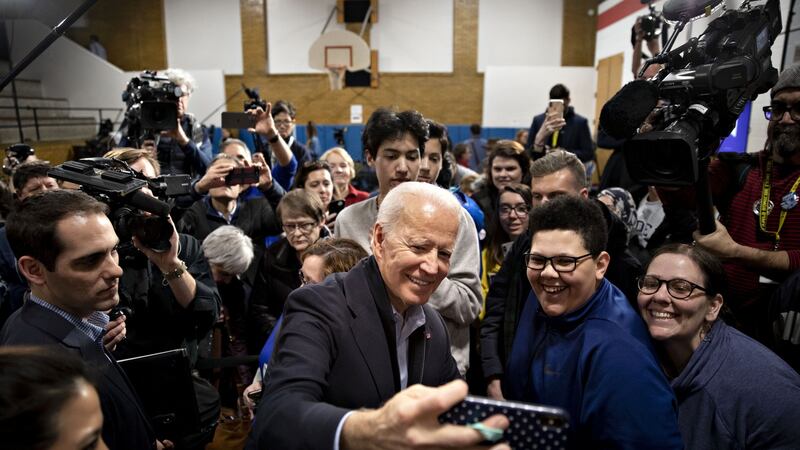 Former US vice-president Joe Biden takes a selfie with attendees during a campaign event in Cedar Rapids, Iowa. Photograph: Daniel Acker/Bloomberg