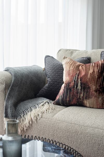 Mixing fabrics in different textures is a great way to add depth and interest to a room while encouraging interaction and enhancing comfort. Photograph: Anna Wickham