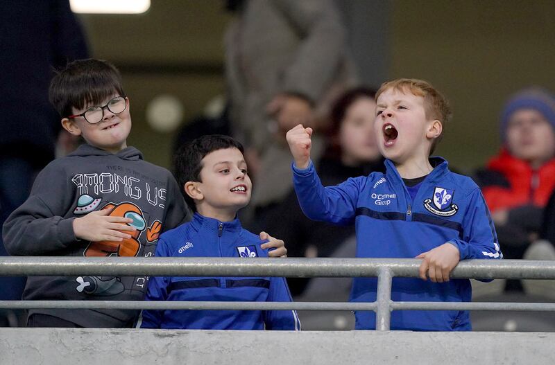 Young Sarsfields fans cheers on their side. Photograph: James Lawlor/Inpho