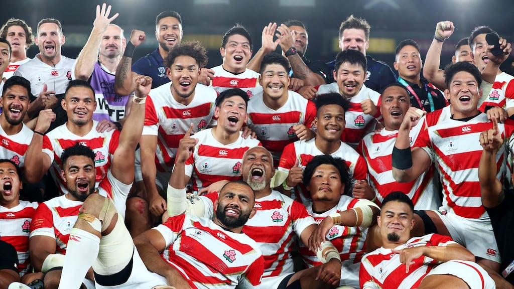 Japan players celebrate their victory over Scotland at International Stadium Yokohama. The home side’s daring, energetic, high-tempo rugby thrilled all spectators. Photograph: Clive Rose/Getty Images