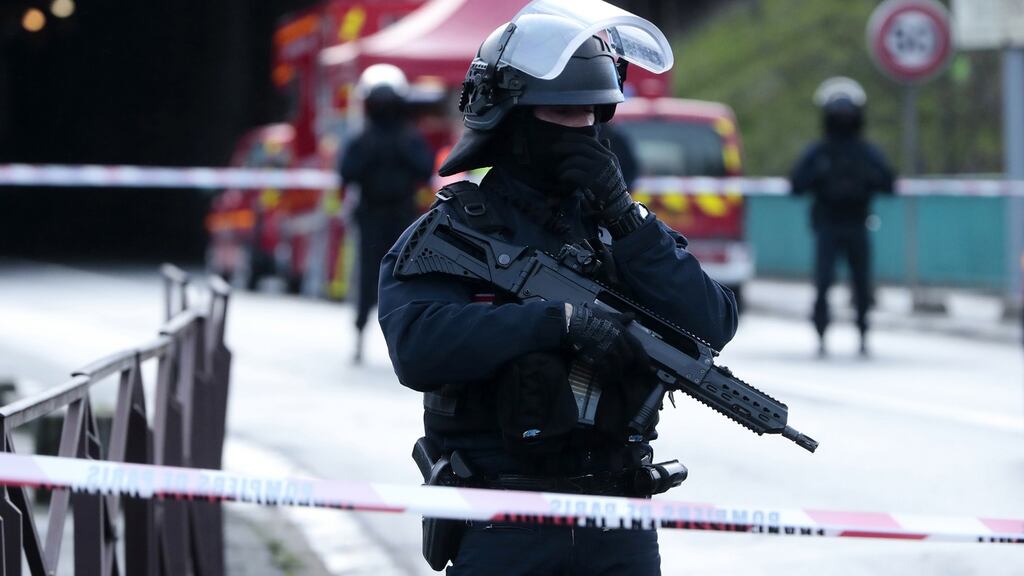 Armed officers secure the perimeter at the Hautes-Bruyeres public park in Villejuif, near Paris. Photograph: EPA