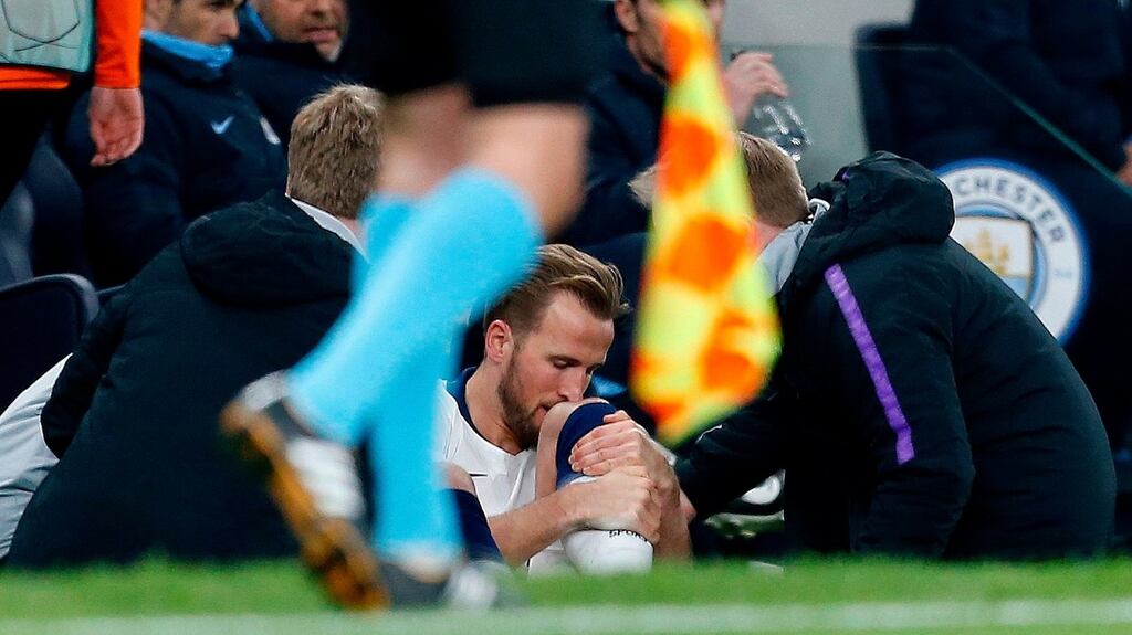 Tottenham’s Harry Kane receives treatment in the first leg against Manchester City. Photograph: Getty Images