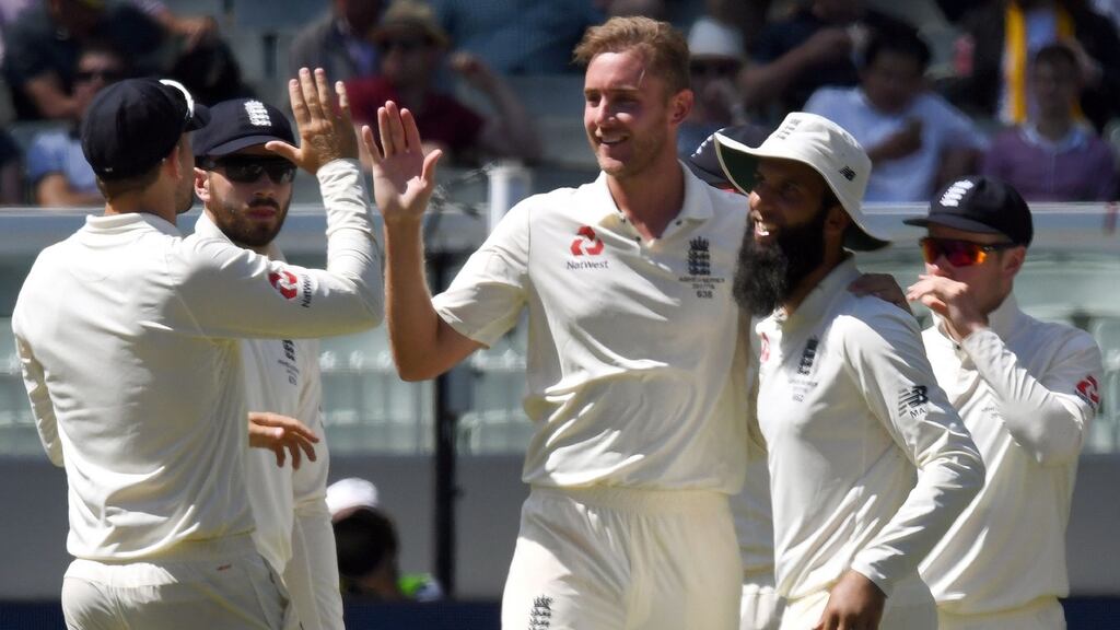 England’s Stuart Broad is congratulated by teammates after dismissing Australia’s batsman Usman Khawaja. Photograph: Getty Images