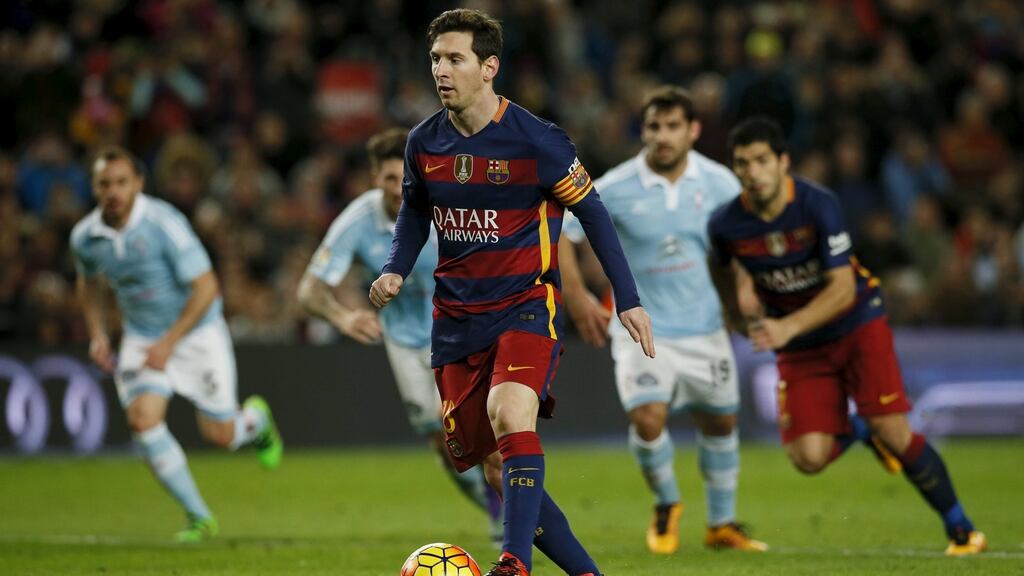 Lionel Messi takes a penalty to assist Luis Suarez to score a goal against Celta Vigo in their La Liga clash. Photo: Andre Gea/Reuters