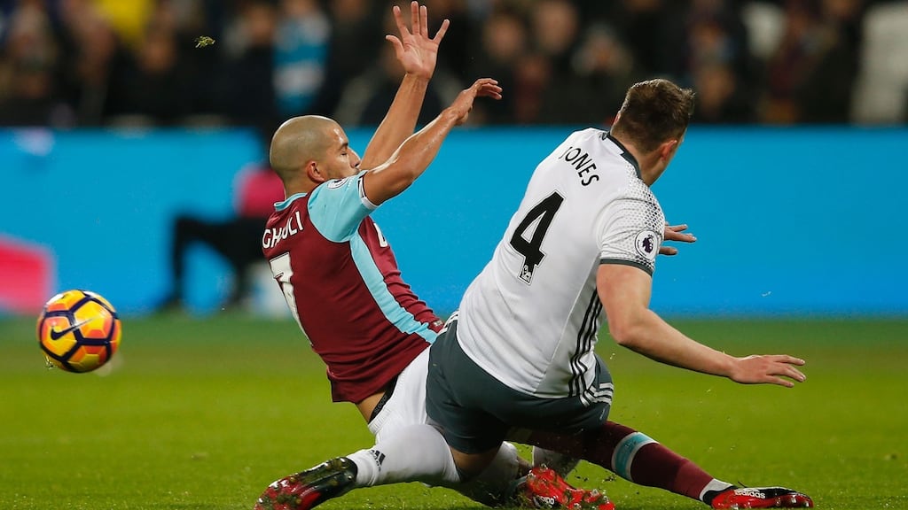 West Ham’s Sofiane Feghouli challenges Manchester United’s Phil Jones during the Premier League game at at The London Stadium. Feghouli received a red card for the challenge, which was overturned on appeal. Photograph: Adrian Dennis/AFP/Getty Images