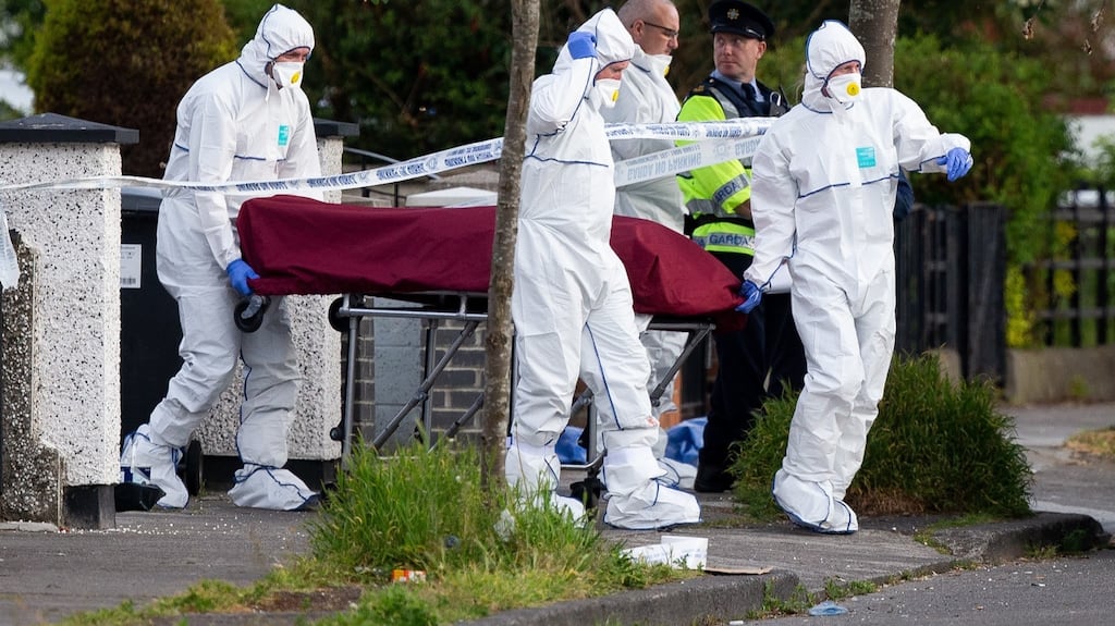 A body is removed from the scene of the shooting at Kilbarron Avenue,    Coolock, Dublin.  Photograph: Tom Honan