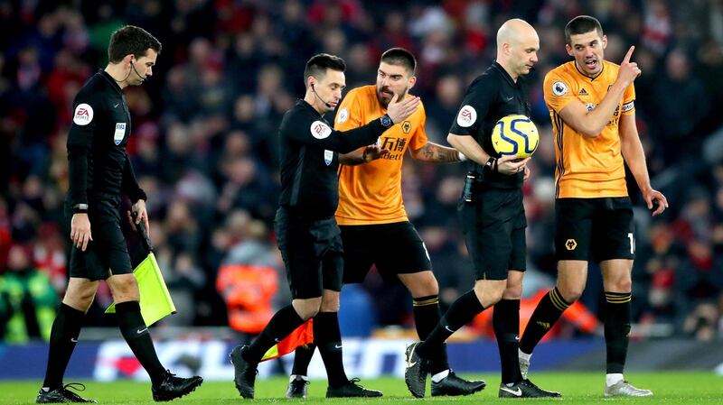 Conor Coady speaks to referee Anthony Taylor at half-time. Photo: Nick Potts/PA Wire