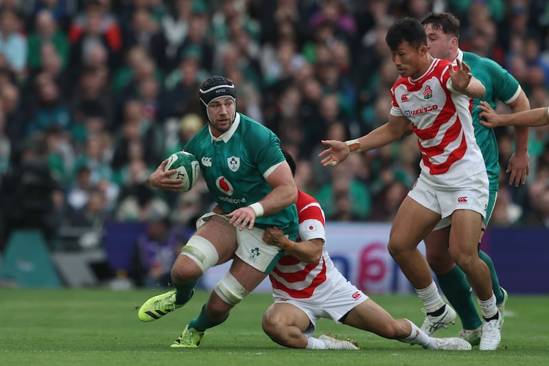 Ireland's Caelan Doris is tackled by Japan's Naoto Saito. Photograph: Gary Carr/Inpho