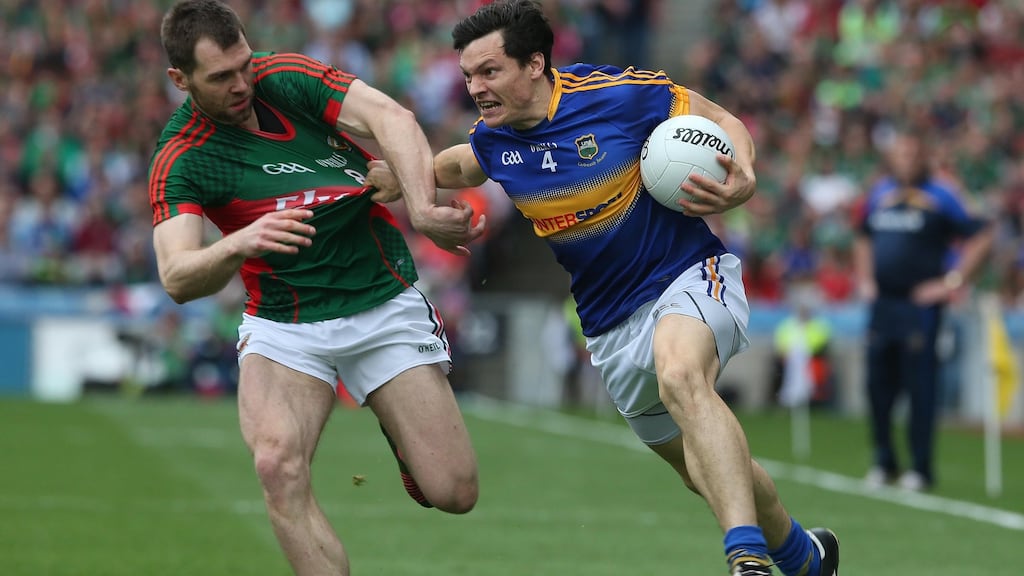 The eldest of the three brothers, Seamus O’Shea gets to grips with Tipperary’s Ciaran McDonald during the All-Ireland semi-finals. Photograph: Inpho