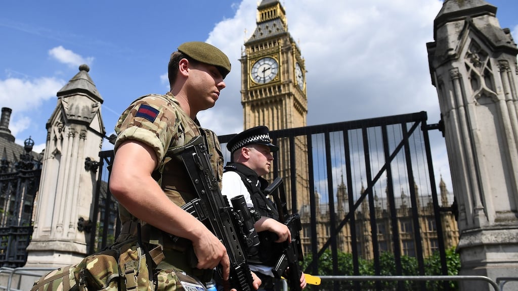 Patrols at Whitehall, near Downing Street and the Houses of Parliament, in central London, on Wednesday. Photograph: Justin Tallis/AFP/Getty Images