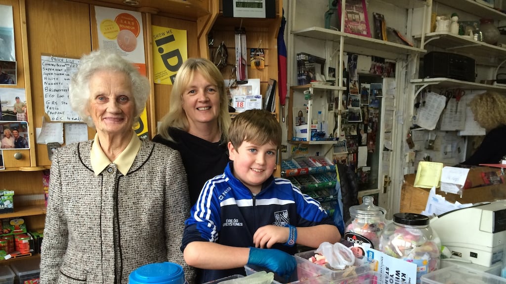 Bridie Mooney (86) in her Greystones shop with her grandson Tadhg (11) and daughter Aine. Photograph: Peter Murtagh