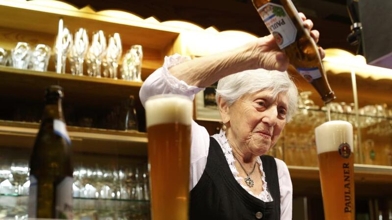 Kathi Kink, who has been a waitress at a Bavarian tavern since 1939. Photograph: Reuters/Michaela Rehle.