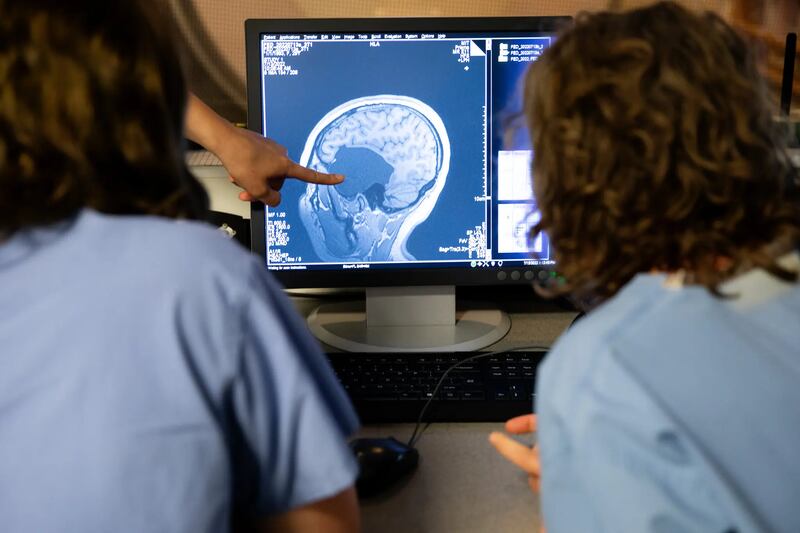 Helen Santoro examining a scan of her brain with her mother at an MIT lab in Cambridge, Massachusetts in July. Photograph: Kayana Szymczak for The New York Times