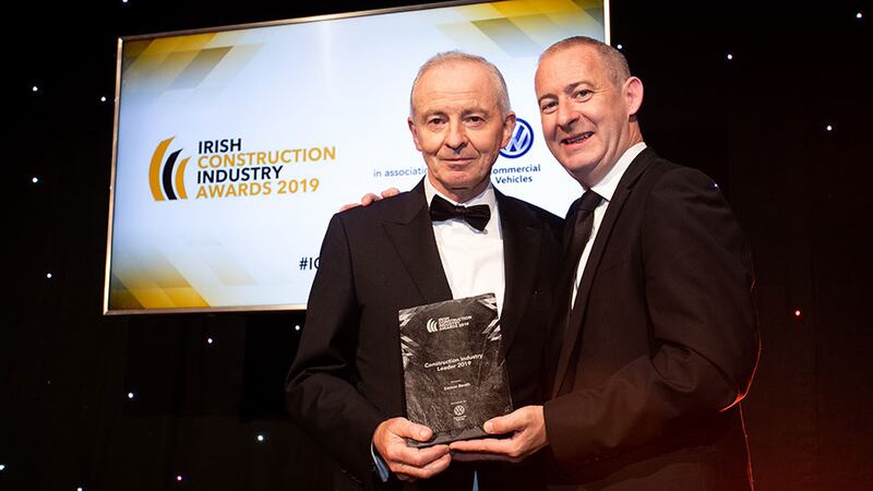 Alan Bateson, Director, Volkswagen Commercial Vehicles Ireland presents the Construction Industry Leader 2019 award to Eamon Booth.