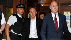 Mother charged in court with murder of three children