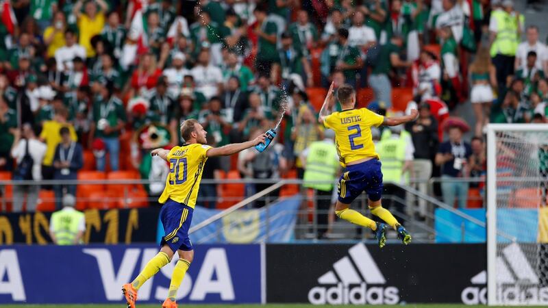 Mikael Lustig and Ola Toivonen celebrate after the match. Photo: Andrew Couldridge/Reuters
