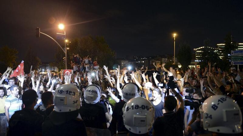 Demonstrators shout nationalist slogans during a protest in front of the headquarters of the Hurriyet building. Photograph: Levent Kulu/Hurriyet Daily