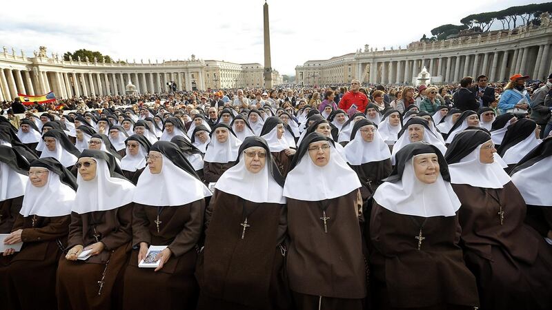 Nuns wait for the arrival of Pope Francis for a canonisation ceremony of four new saints in St Peter’s Square, Vatican City. Photograph: Giuseppe Lami/EPA