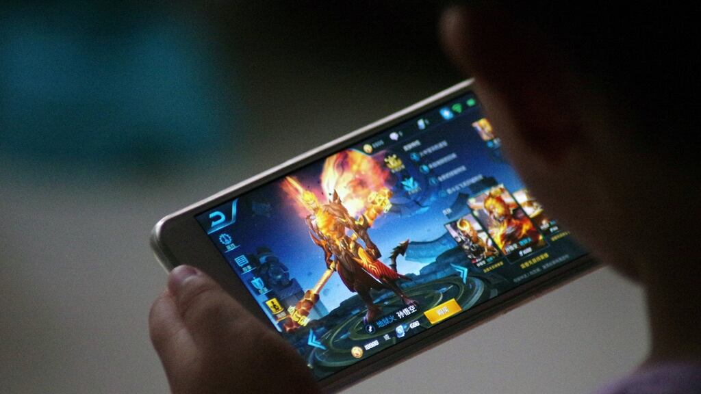 A child plays the game “Honour of Kings” by Tencent. Photograph: Reuters/Stringer