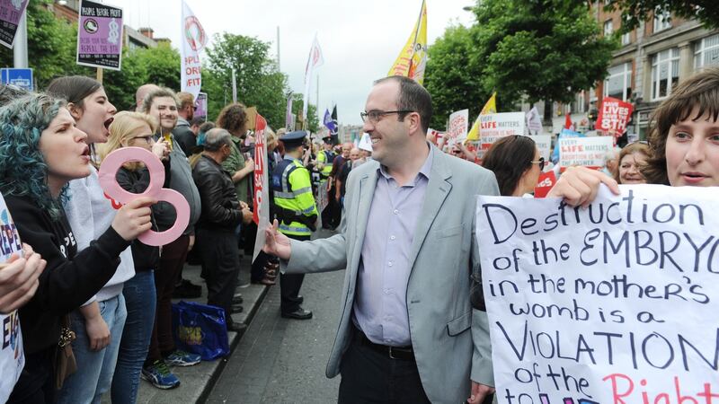 An anti-abortion demonstrator argues with a pro-choice protest during an annual rally in Dublin. Photograph: Aidan Crawley