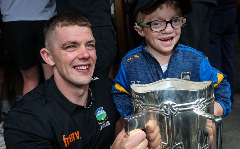 Ronan Maher with Tipperary supporter Oisín Crowe during the All-Ireland champions' visit to Children's Health Ireland at Crumlin. Photograph: Ryan Byrne/Inpho